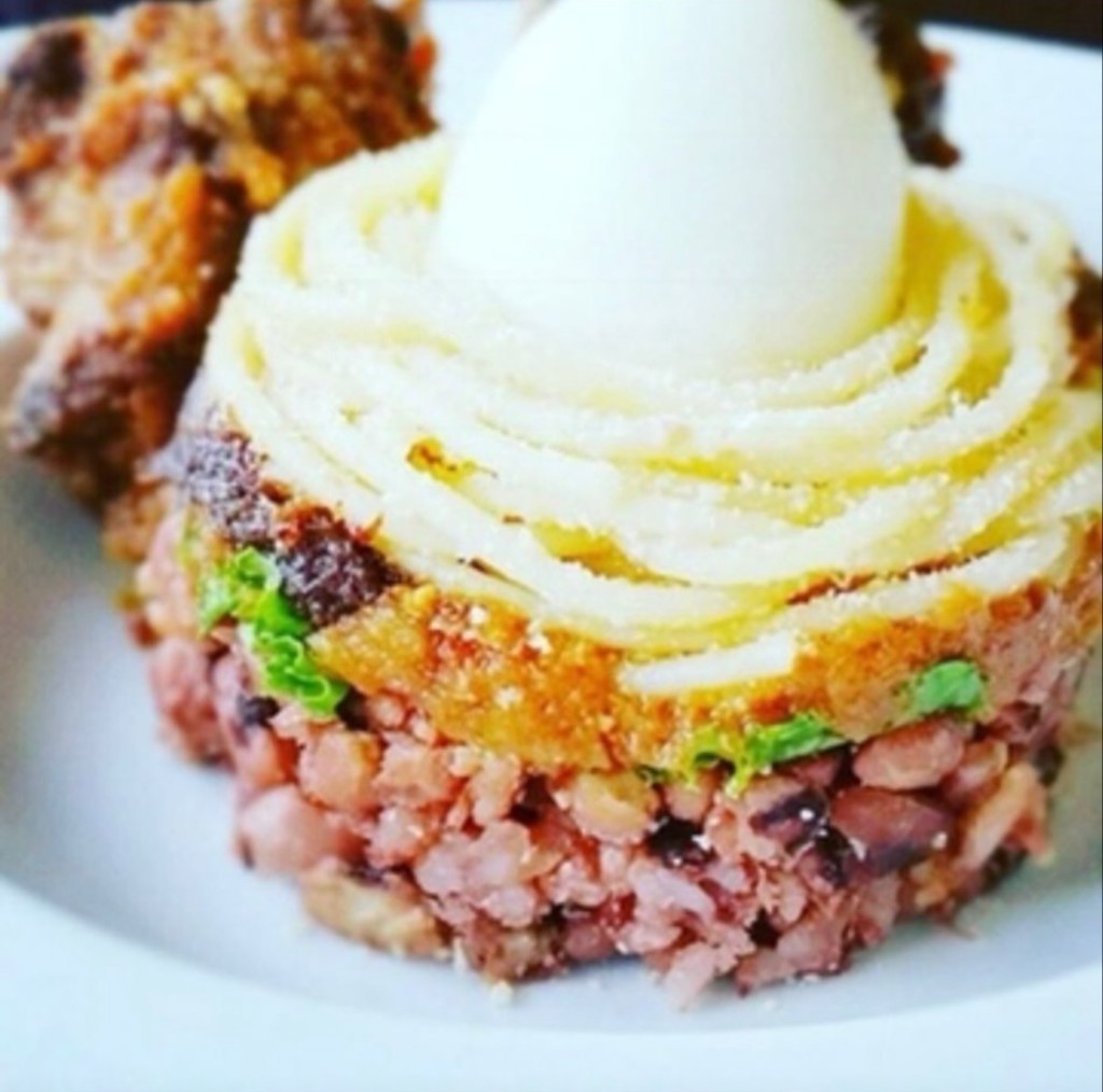 Plated rice and fish with egg garnish