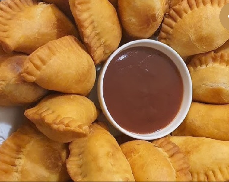 Savory pastries with sauce