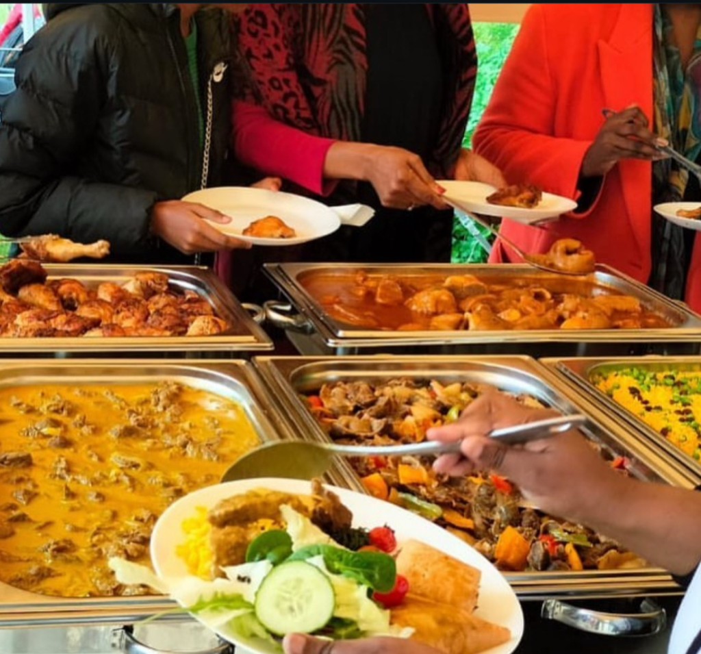 Guests enjoying buffet during catering service